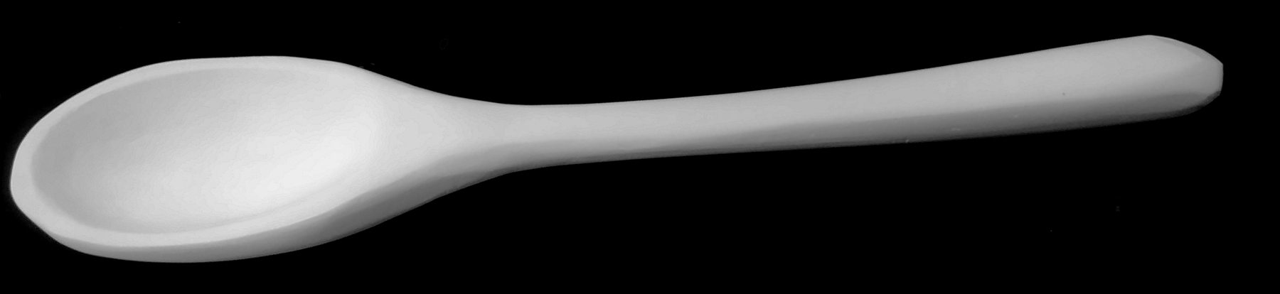 large plaster carving based on a wooden spoon