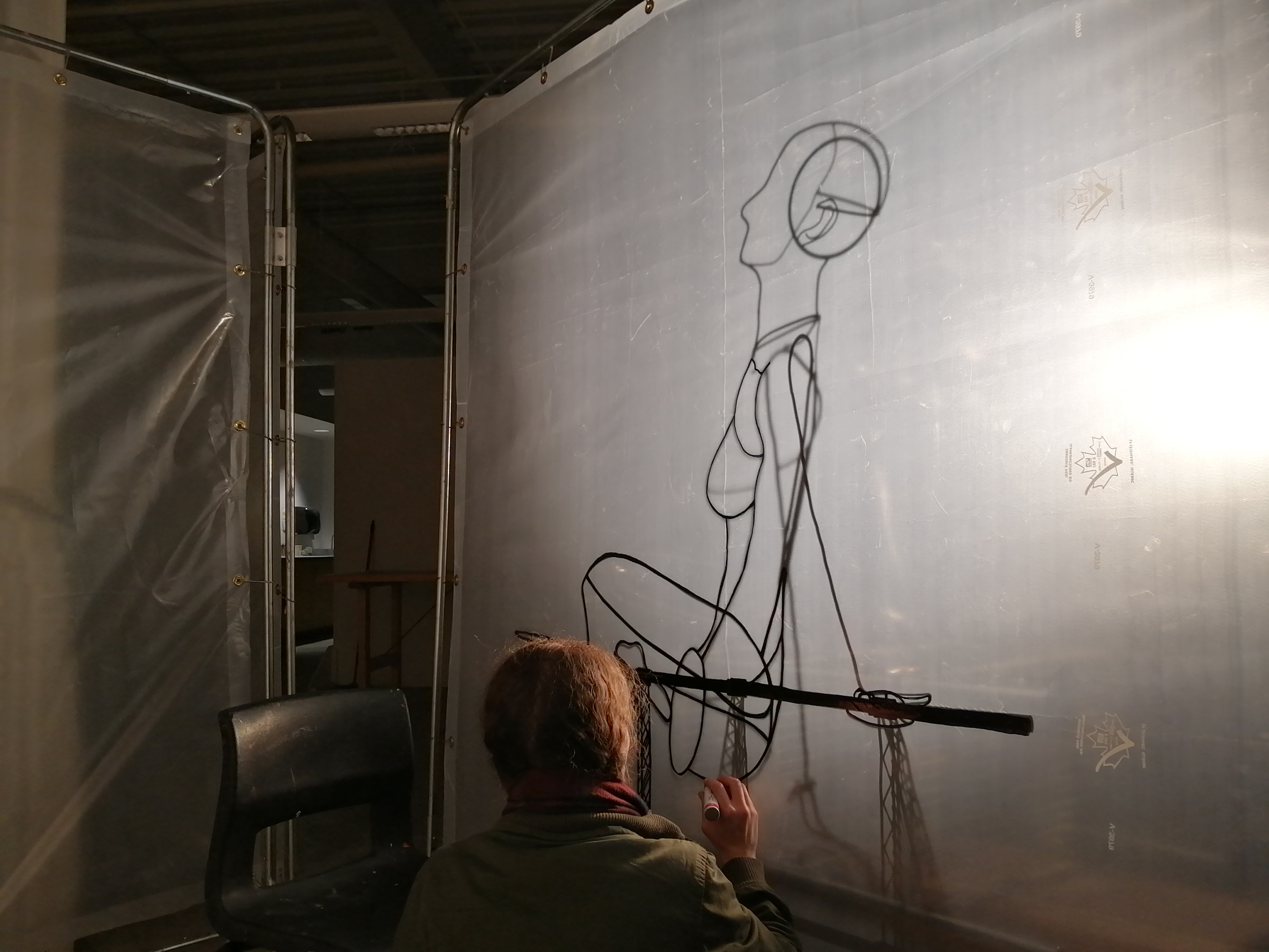 an artwork by Ada Denil consisting of translucent welding screens with line drawings