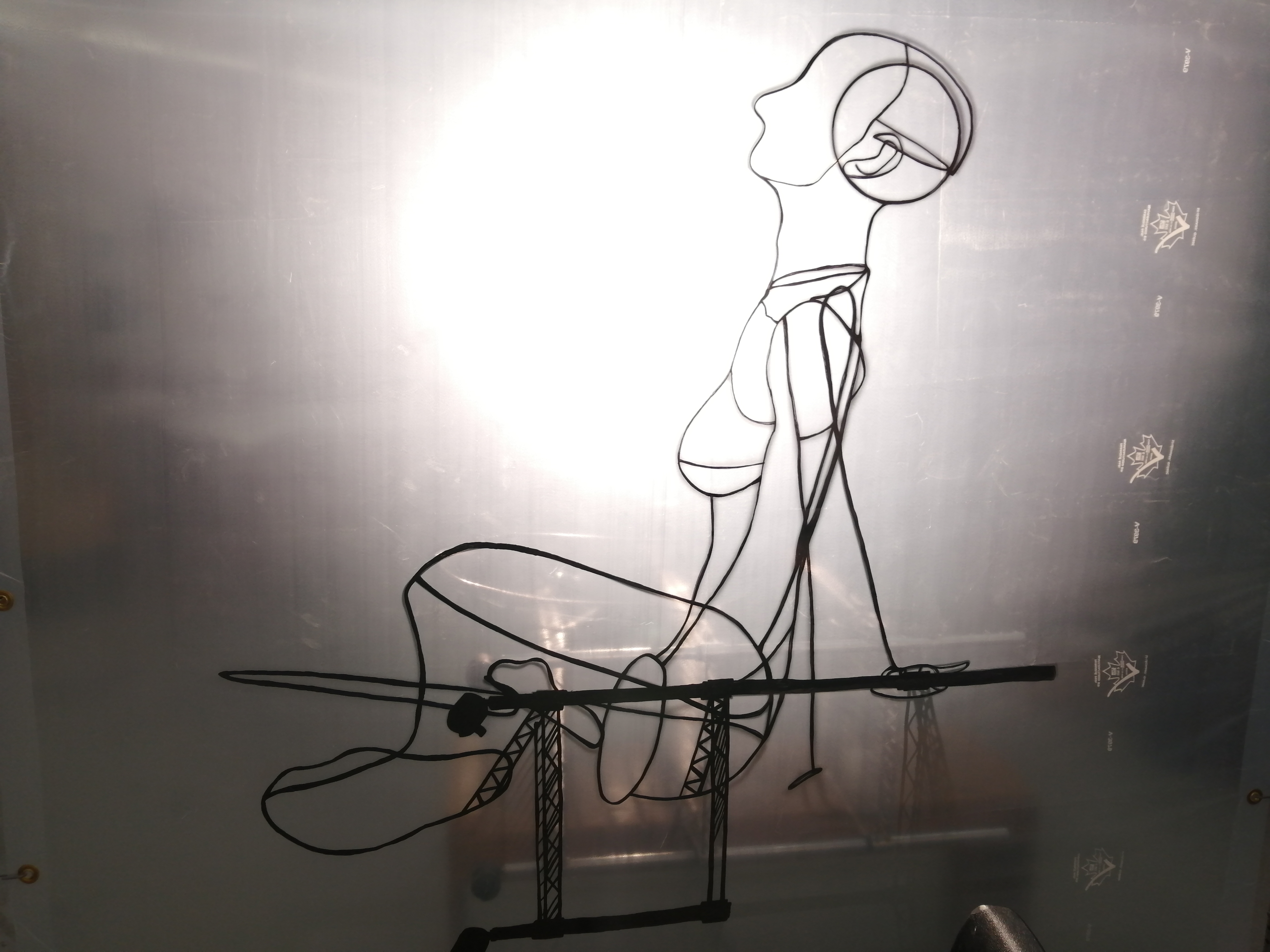 an artwork by Ada Denil consisting of translucent welding screens with line drawings