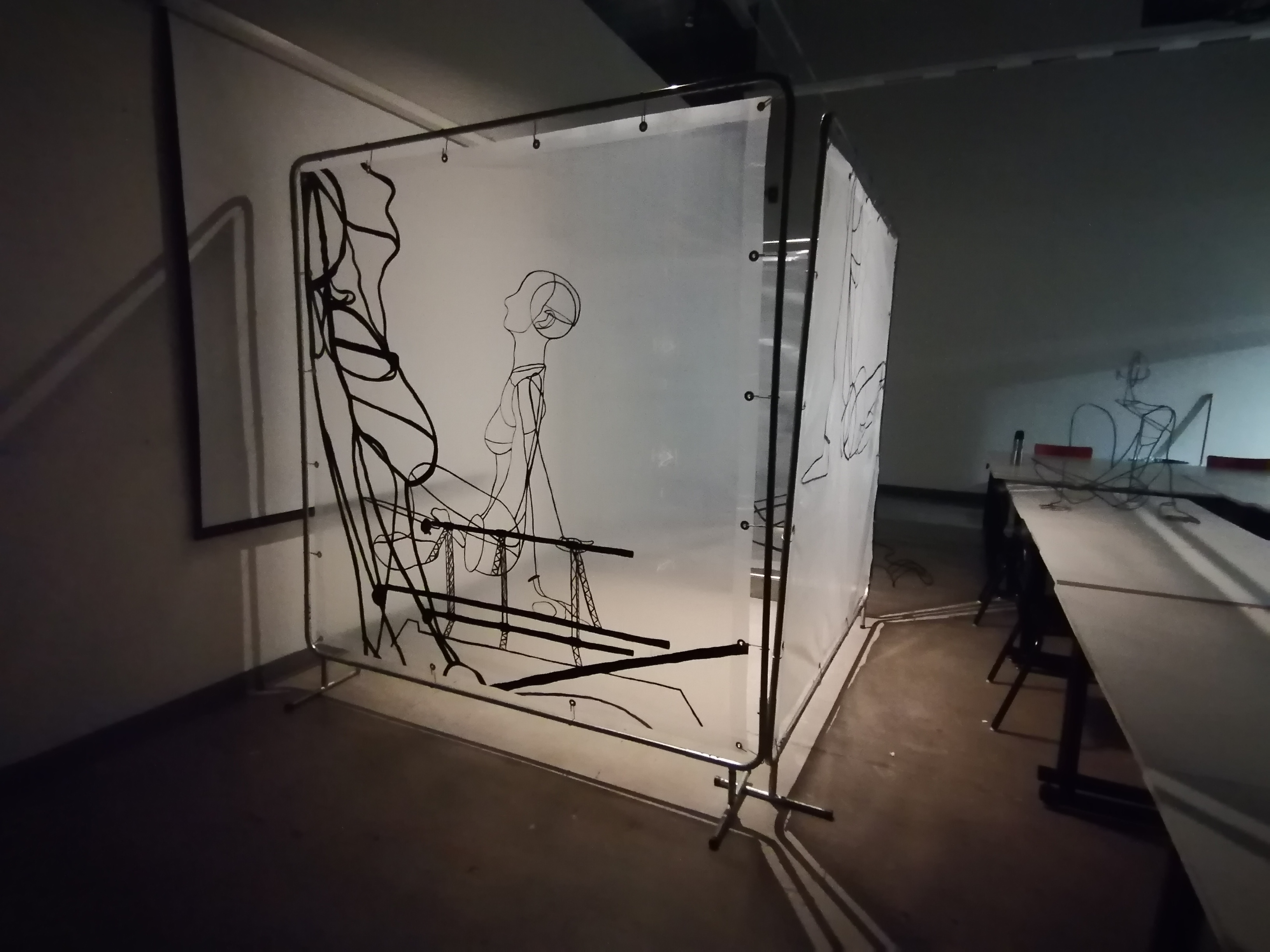 an artwork by Ada Denil consisting of translucent welding screens with line drawings