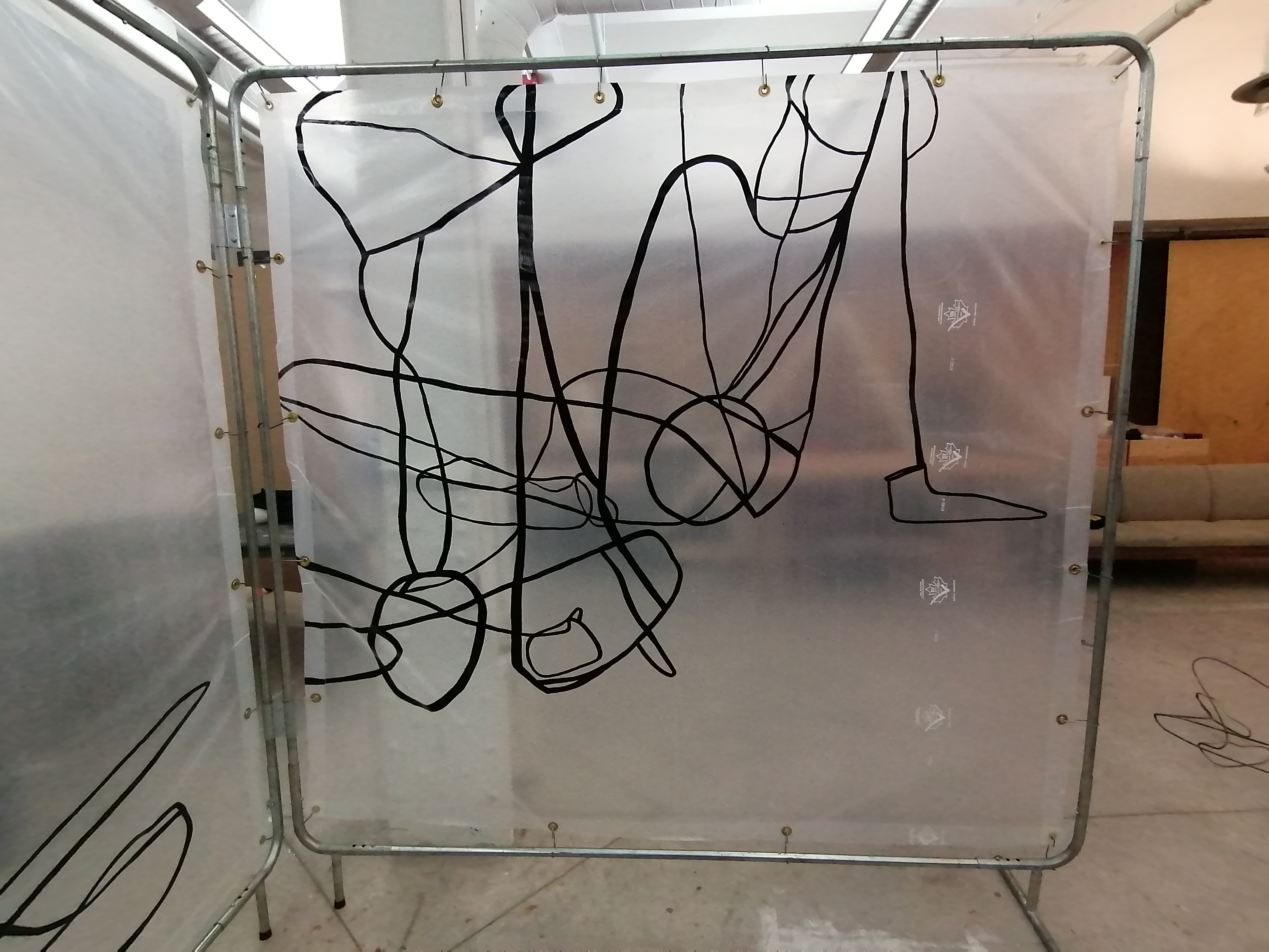an artwork by Ada Denil consisting of translucent welding screens with line drawings
