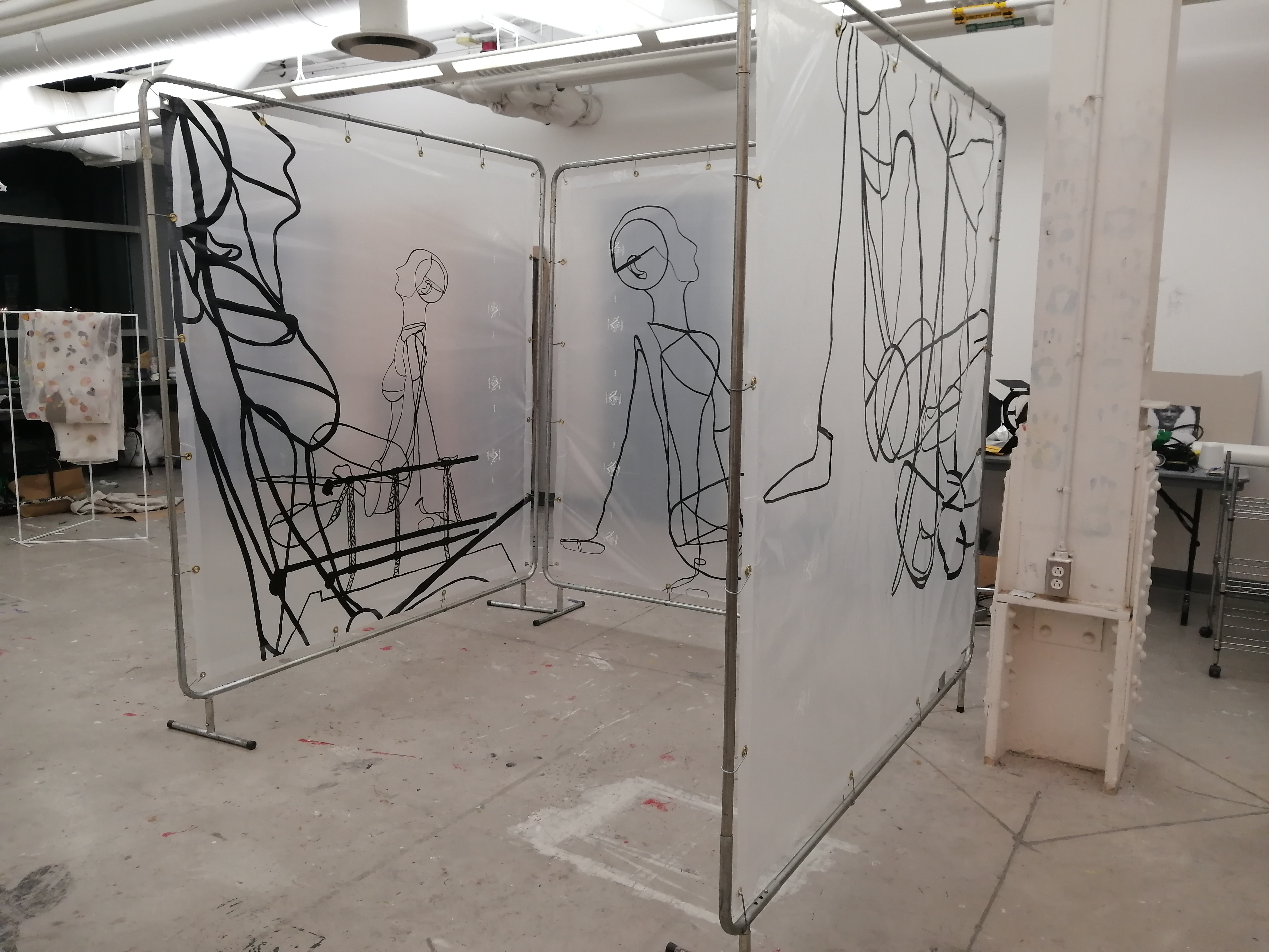 an artwork by Ada Denil consisting of translucent welding screens with line drawings