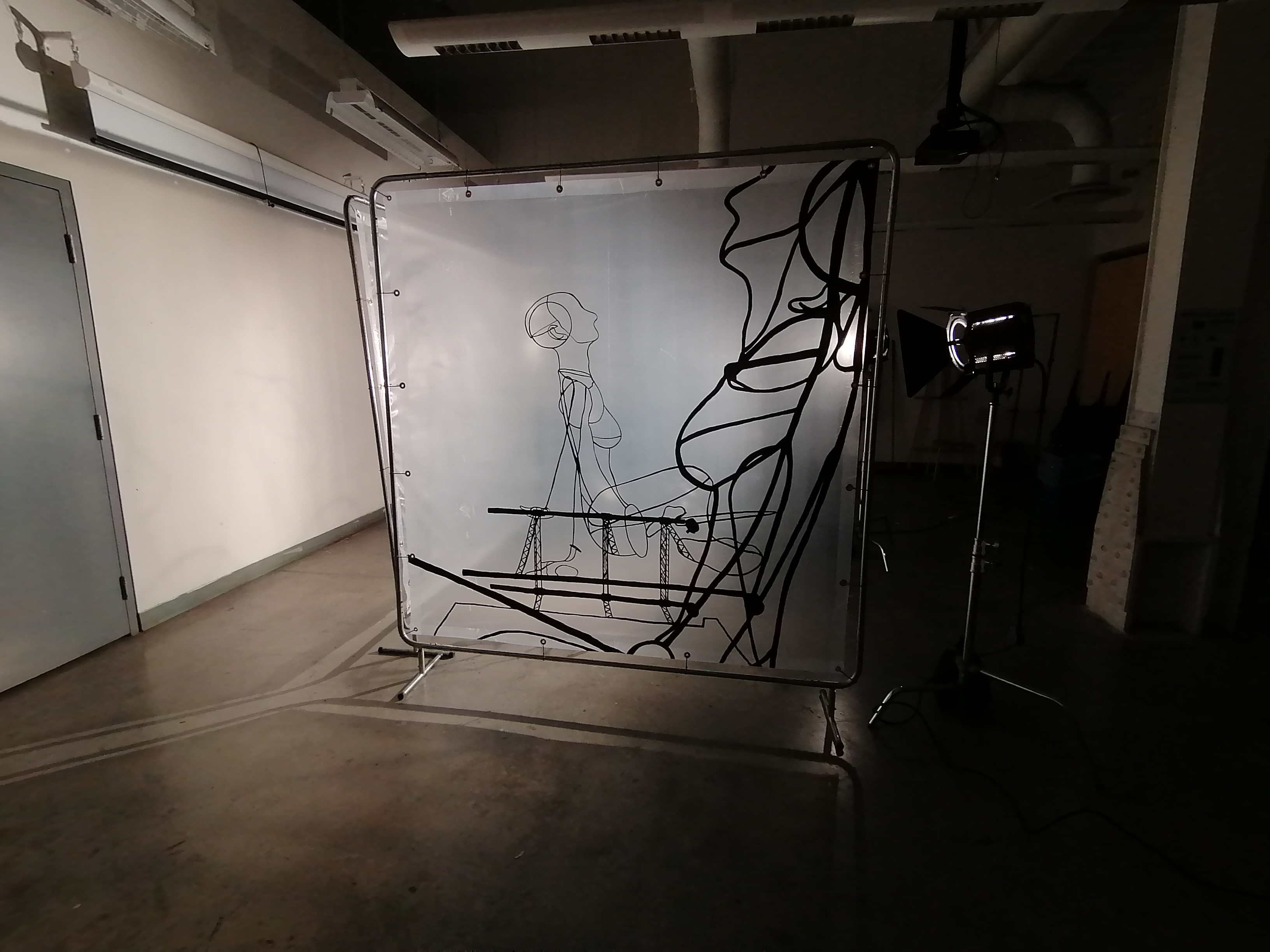 an artwork by Ada Denil consisting of translucent welding screens with line drawings