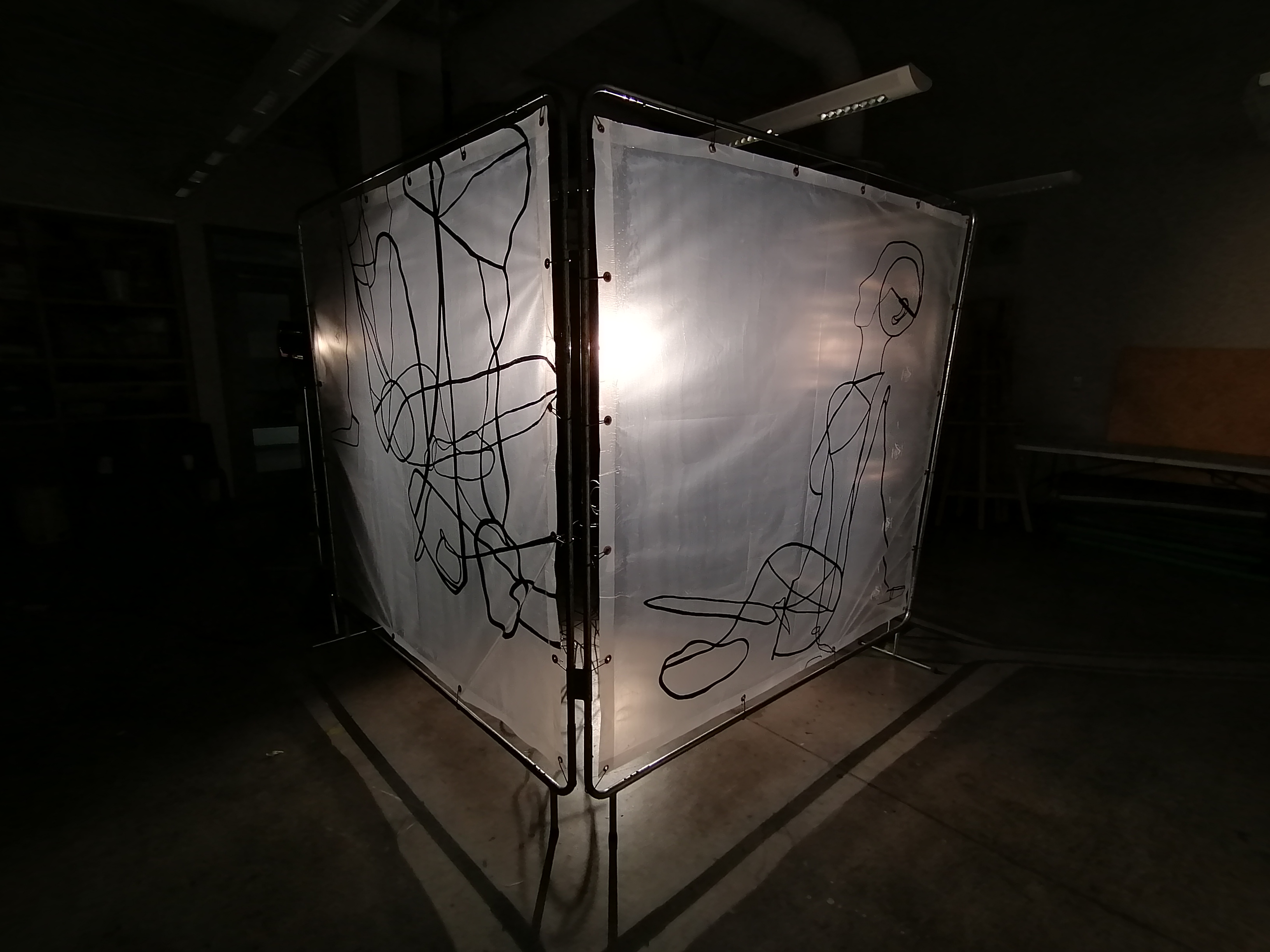 an artwork by Ada Denil consisting of translucent welding screens with line drawings