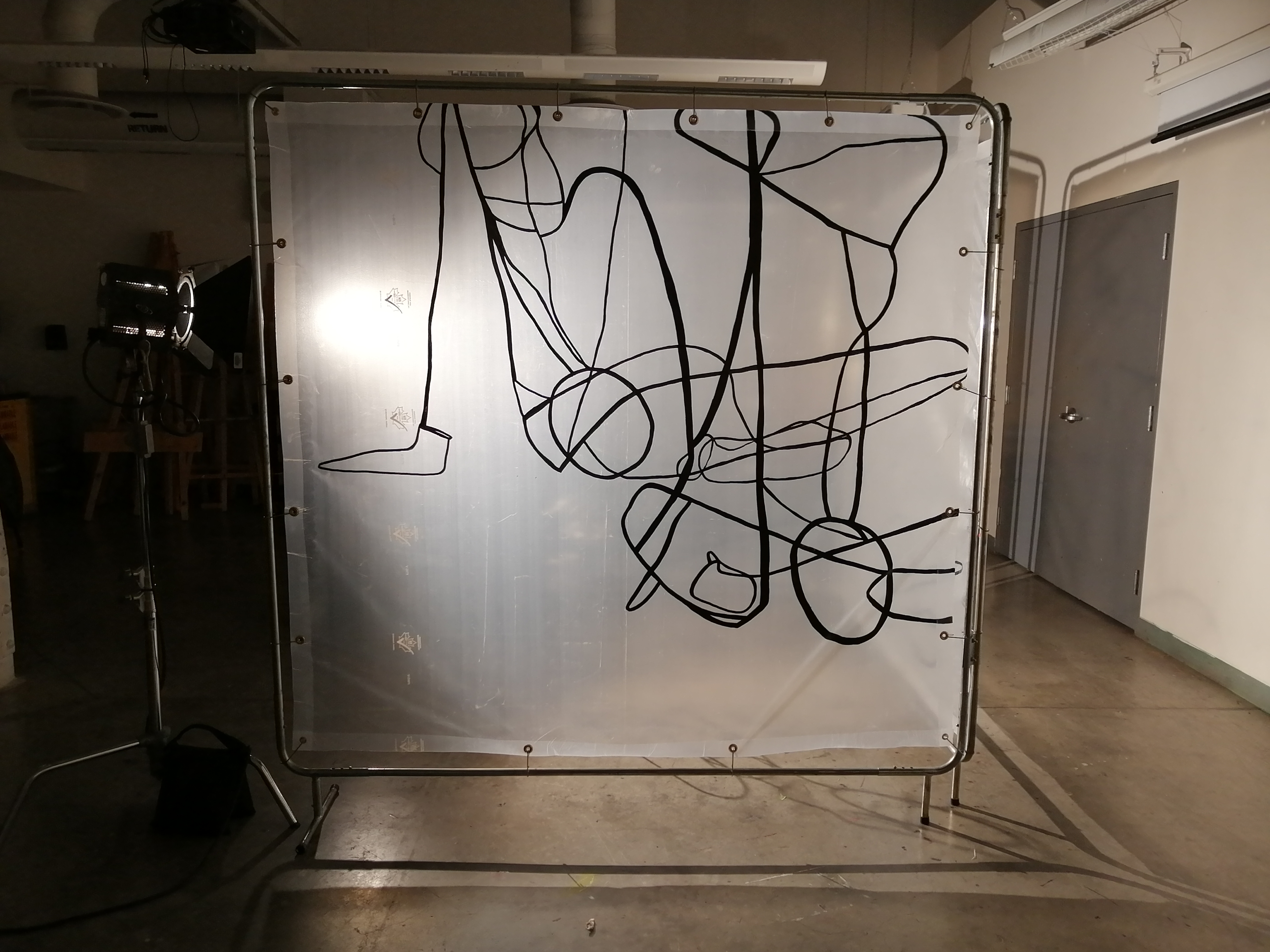 an artwork by Ada Denil consisting of translucent welding screens with line drawings