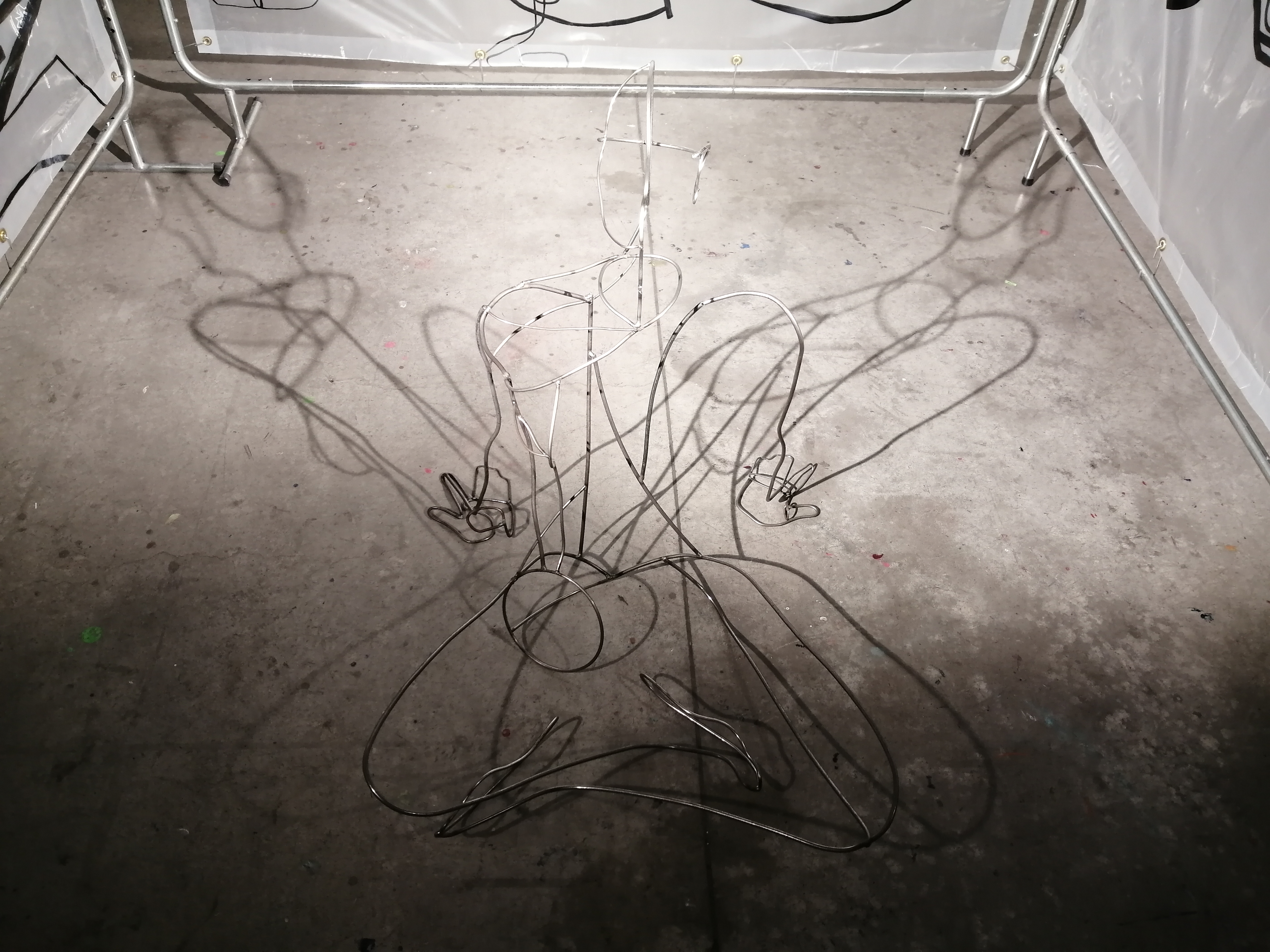 a steel figure constructed with steel rods created by Ada Denil