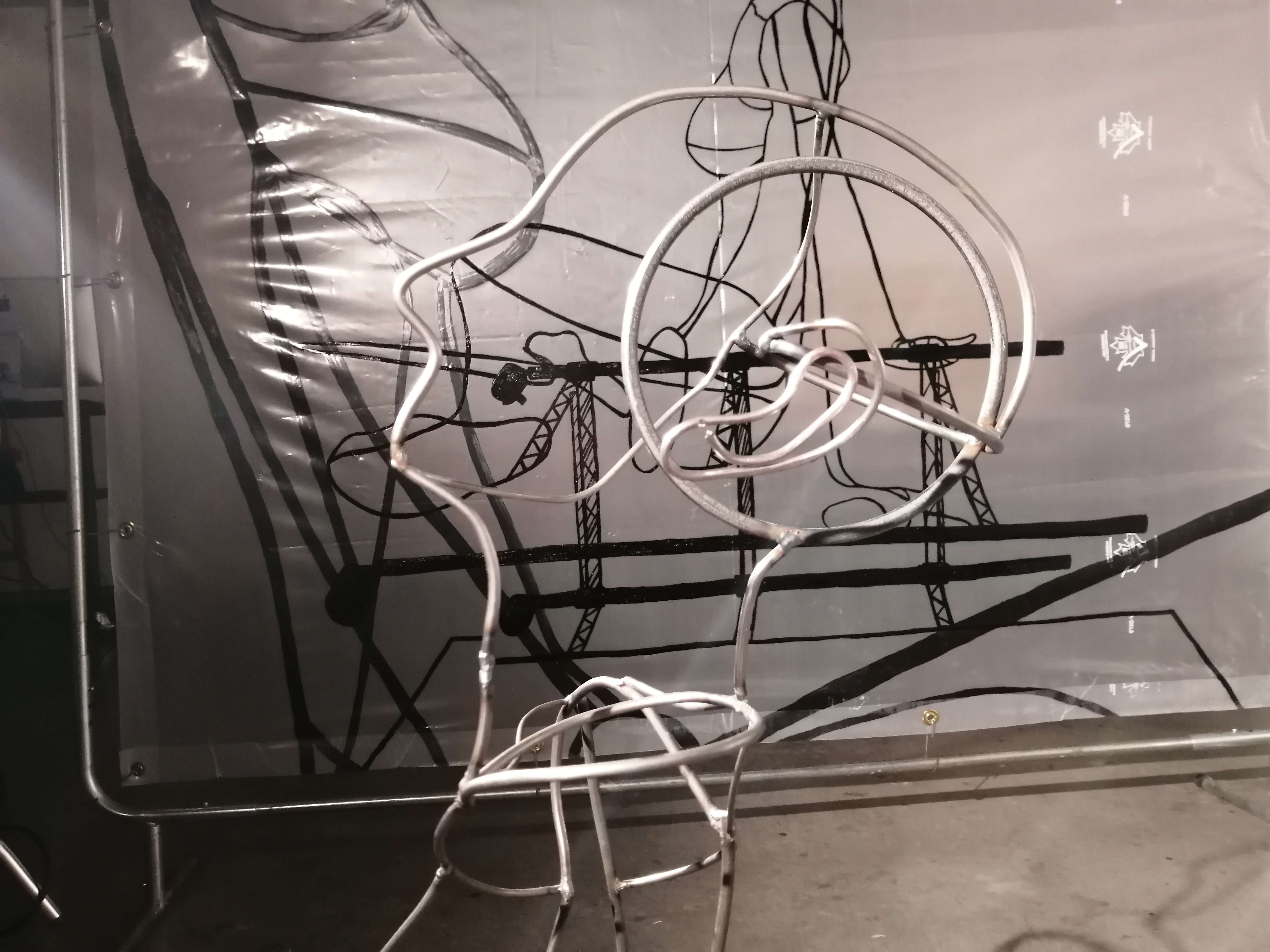 a steel figure constructed with steel rods created by Ada Denil