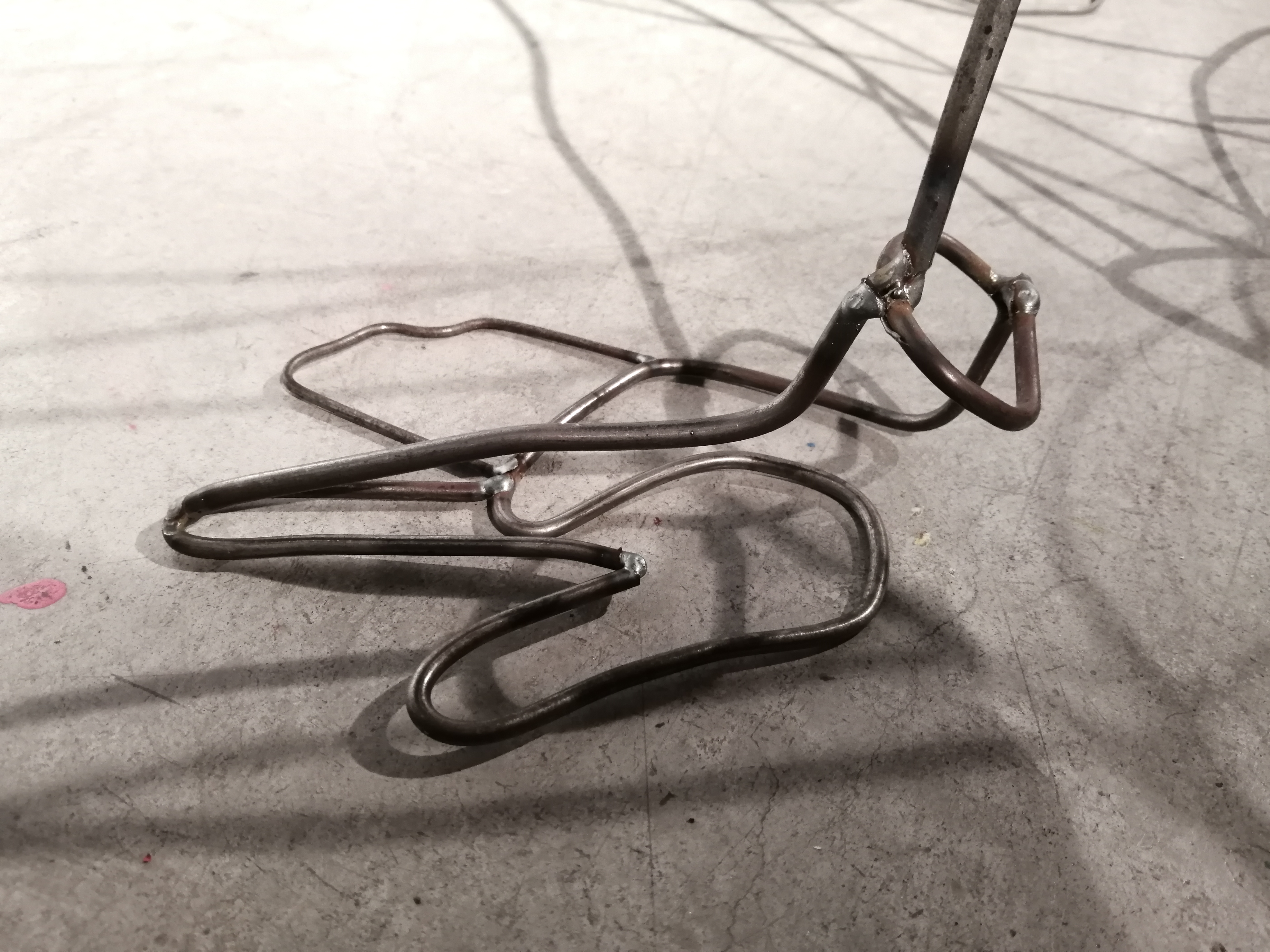 a steel figure constructed with steel rods created by Ada Denil