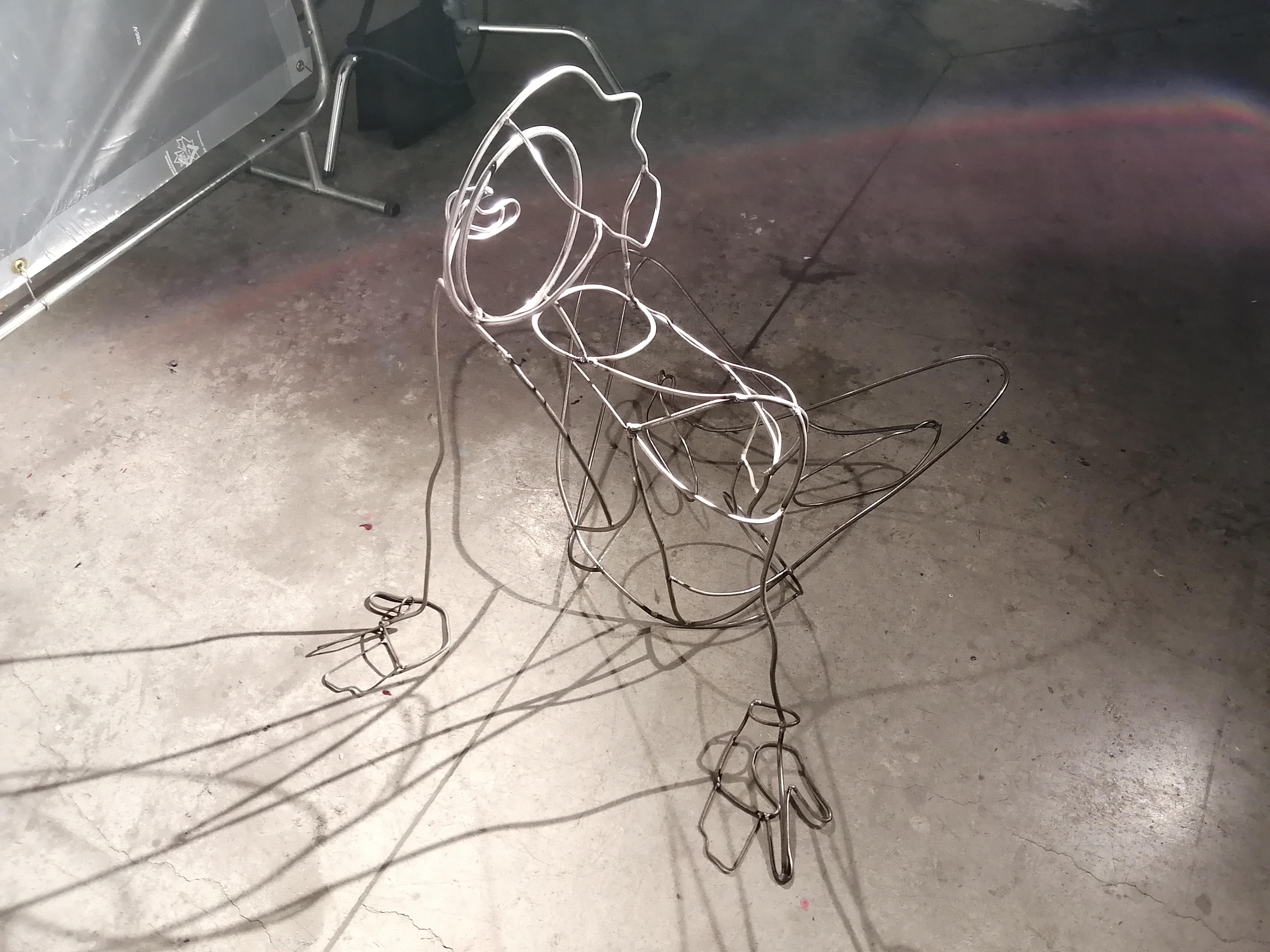 a steel figure constructed with steel rods created by Ada Denil