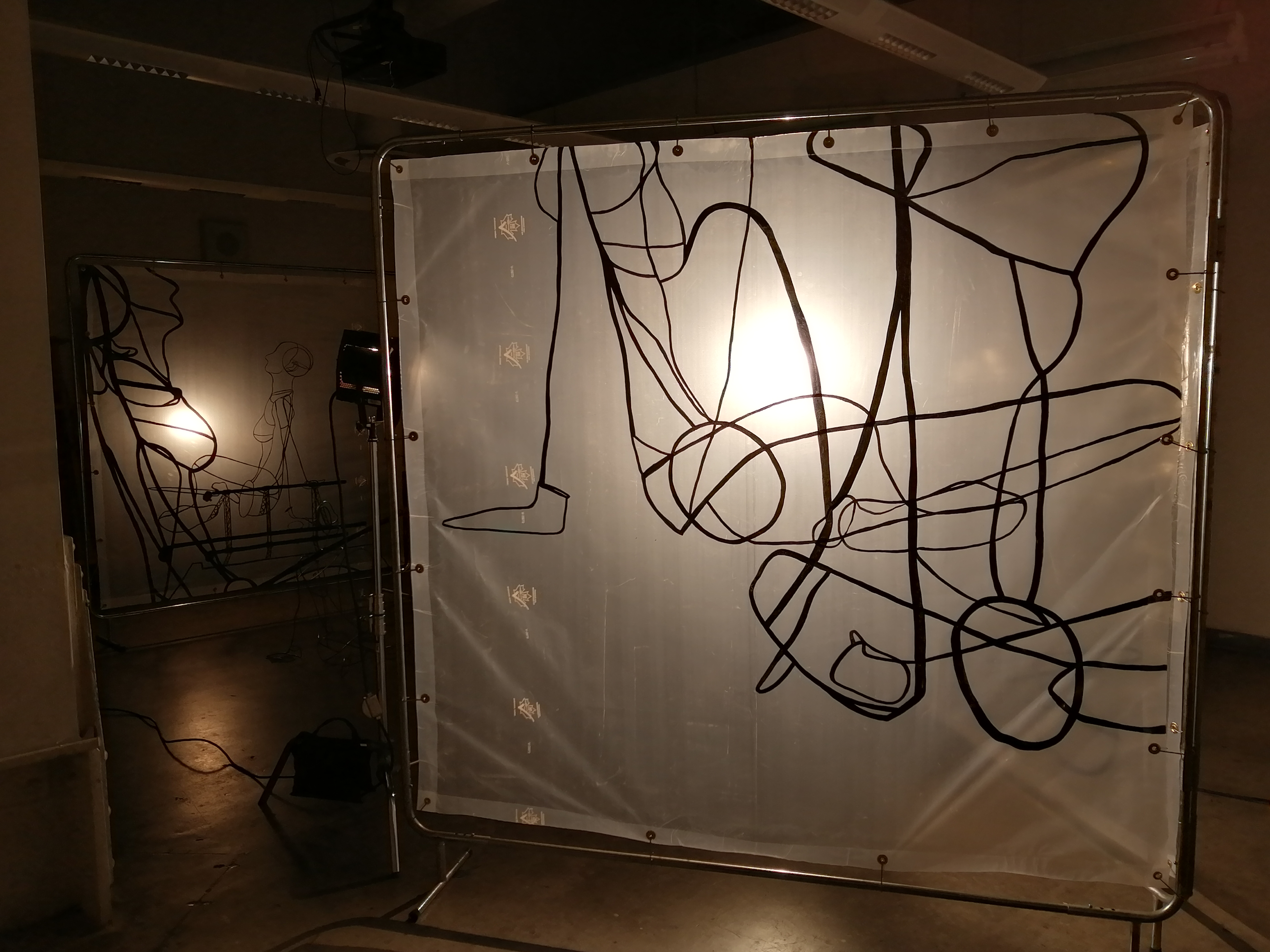 an artwork by Ada Denil consisting of translucent welding screens with line drawings