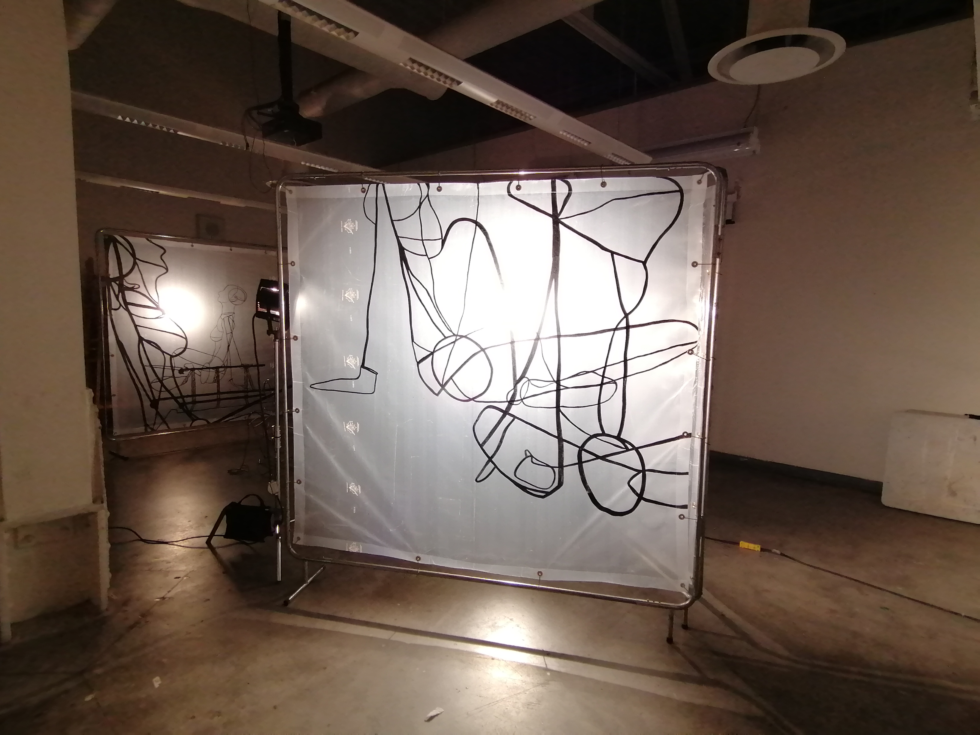 an artwork by Ada Denil consisting of translucent welding screens with line drawings
