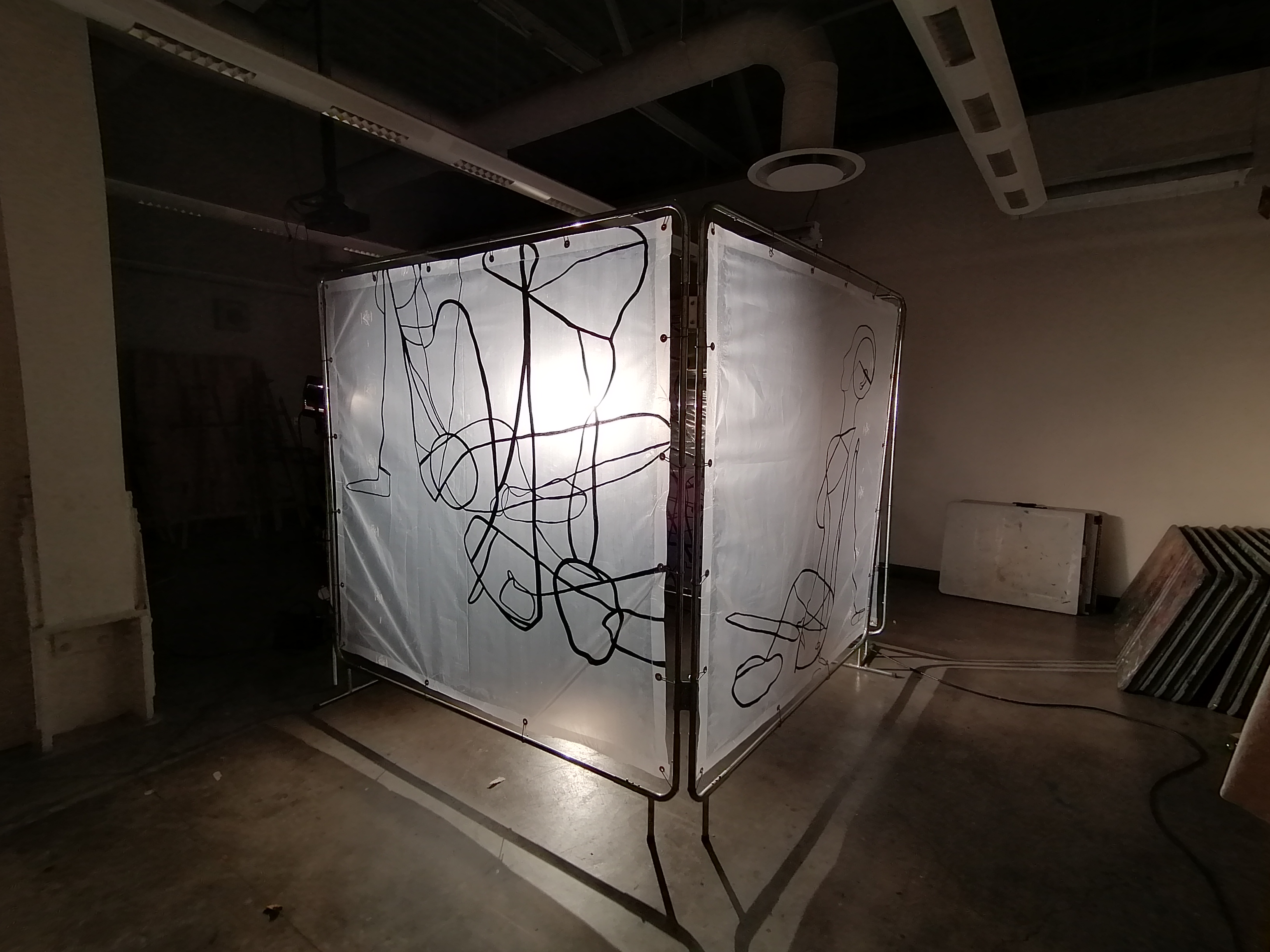 an artwork by Ada Denil consisting of translucent welding screens with line drawings