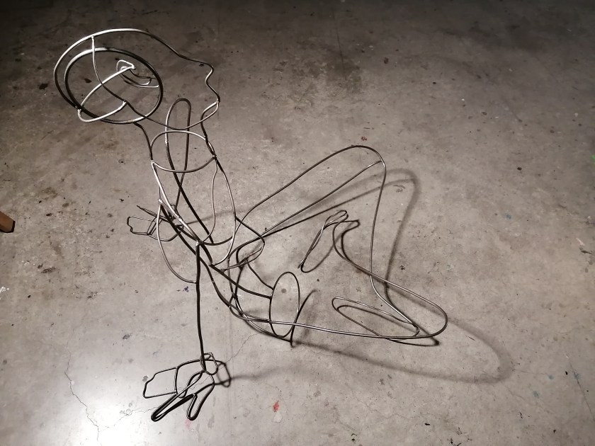 a steel figure constructed with steel rods created by Ada Denil