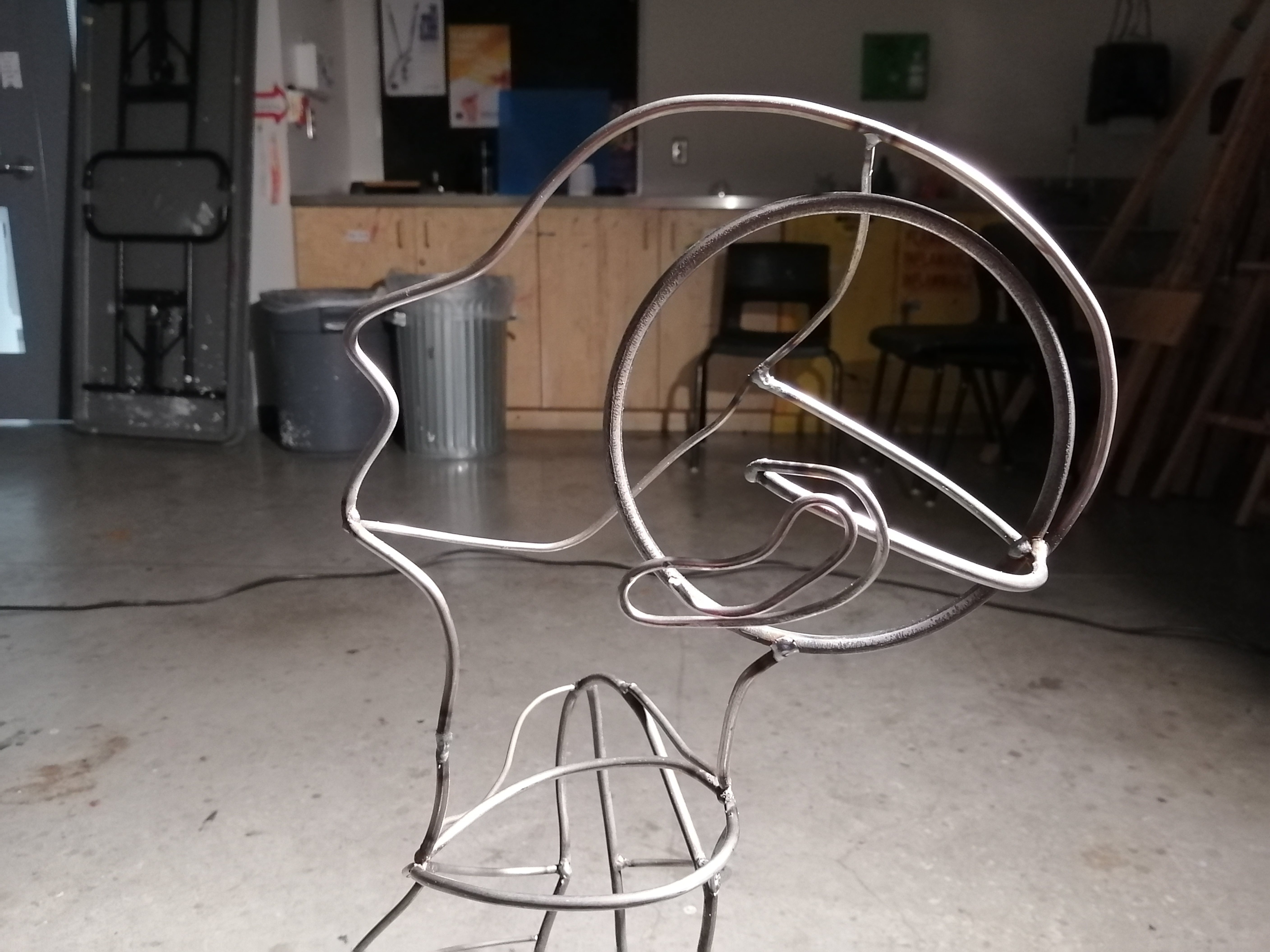 a steel figure constructed with steel rods created by Ada Denil