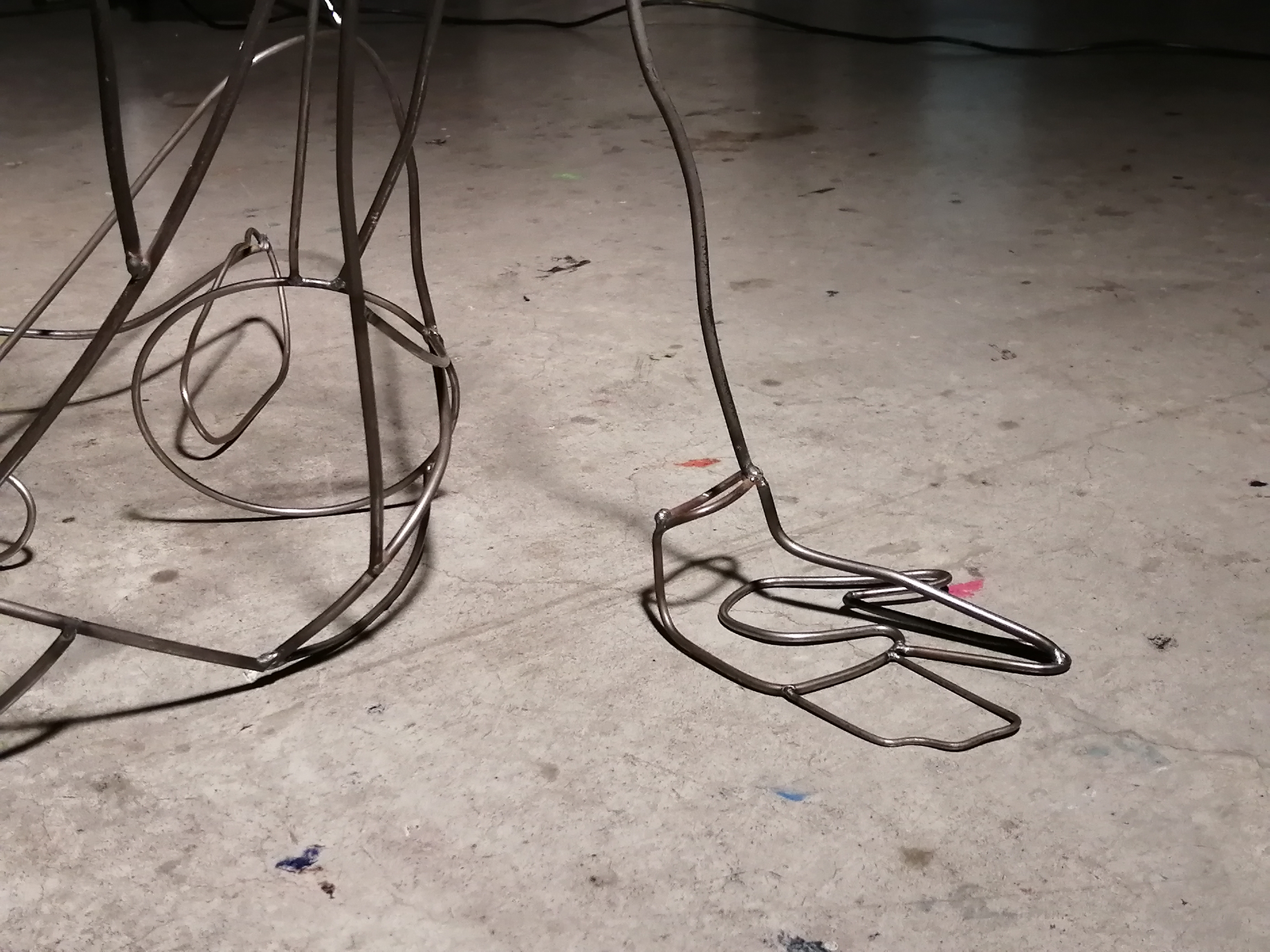 a steel figure constructed with steel rods created by Ada Denil