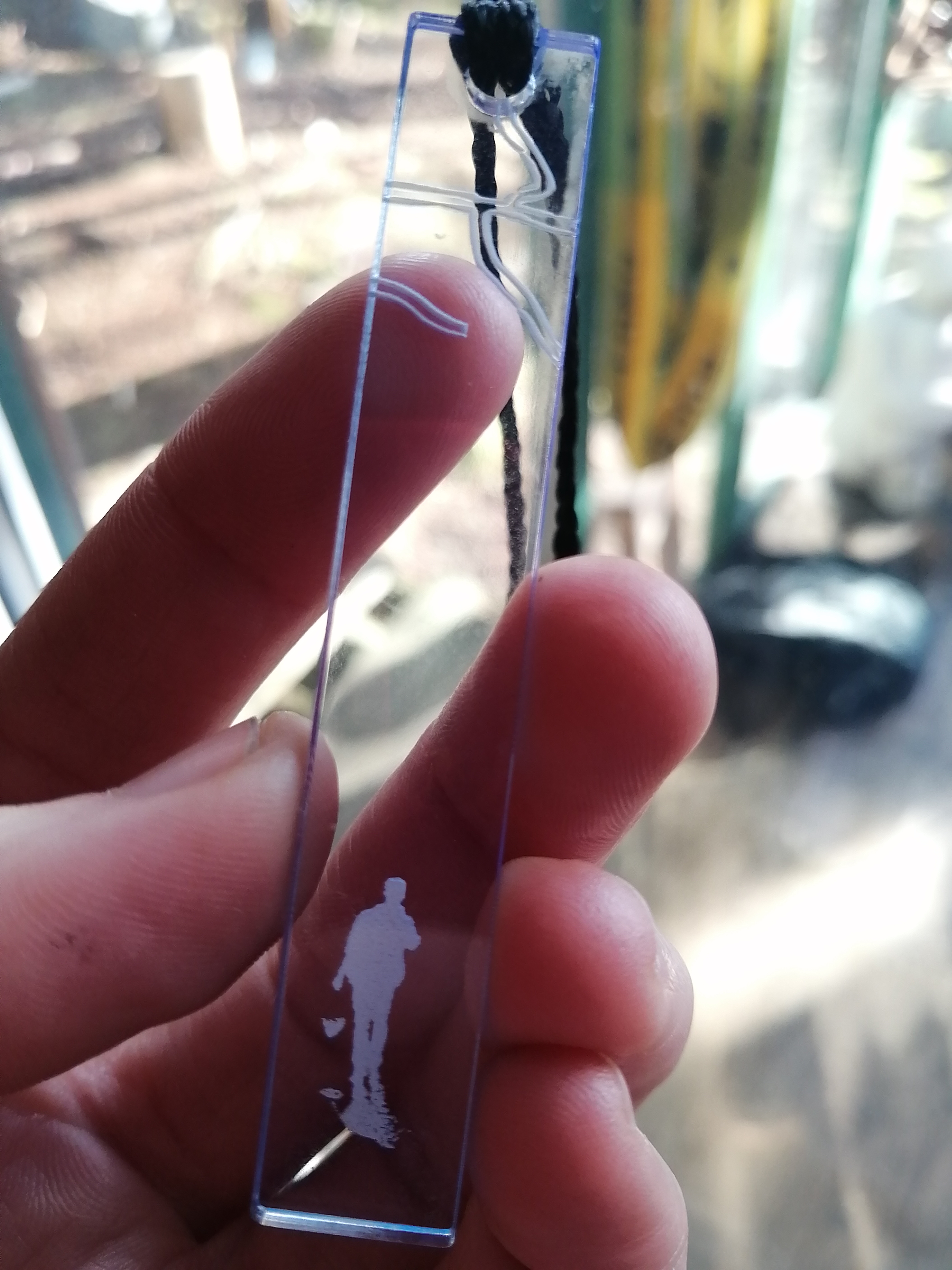 a single laser engraved pendant from a series created by Ada Denil