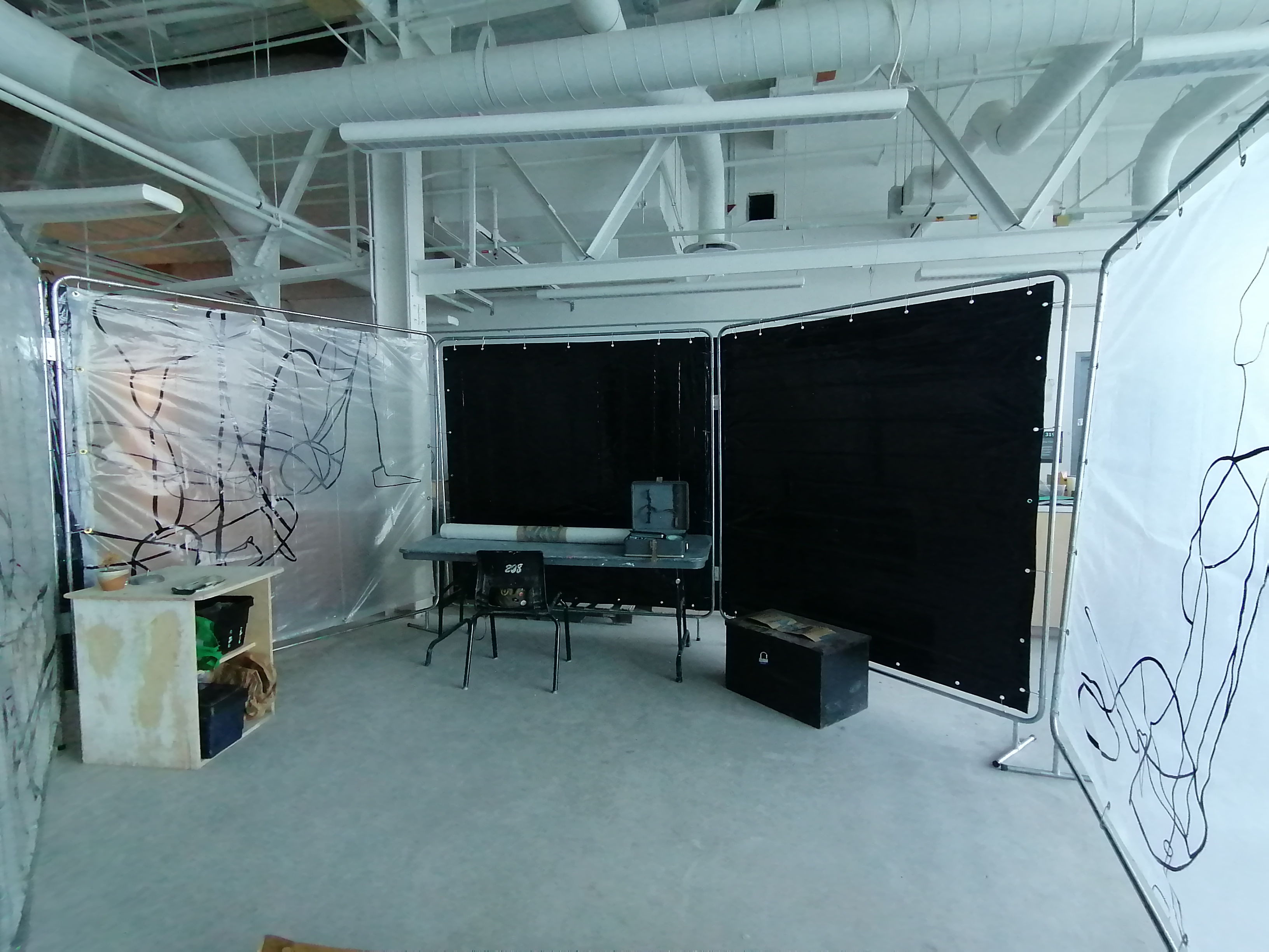 Translucent screens creating a studio space made by Ada Denil 