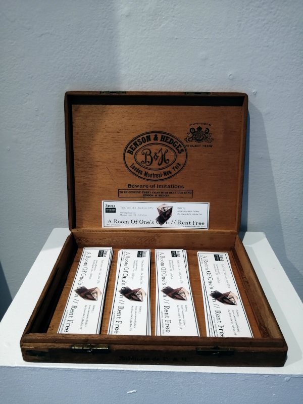 a display of bookmarks advertising the a show by Ada Denil titled A Room of One's Own // Rent Free at the Anna Leonowens Gallery in Halifax, NS